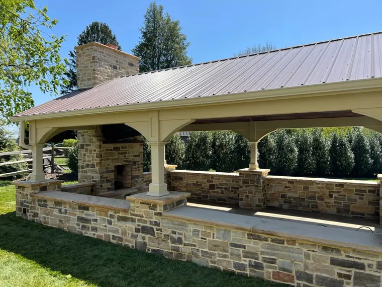 Gable pavilion with stone fireplace and kitchen bar
